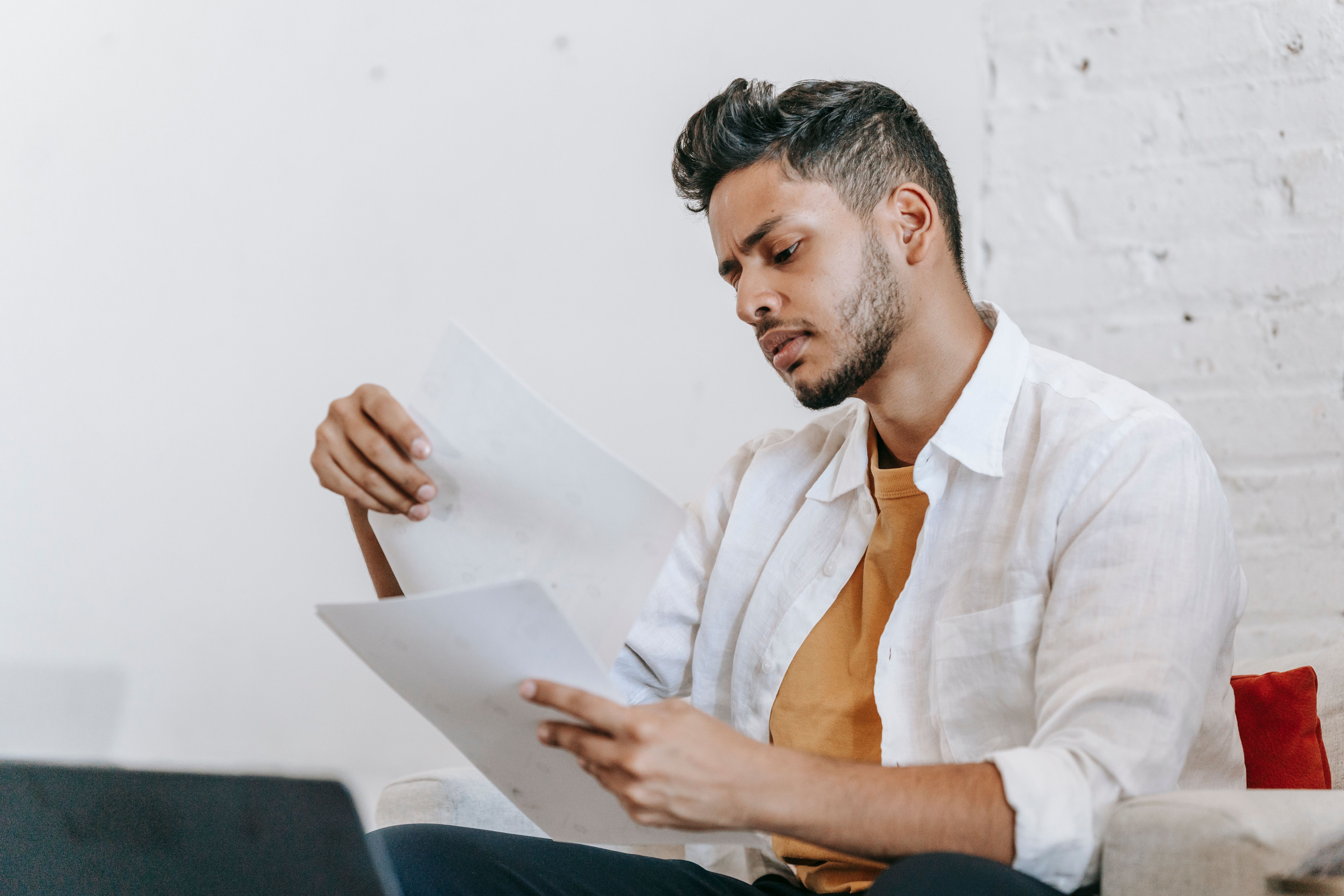 Man reading report on white background