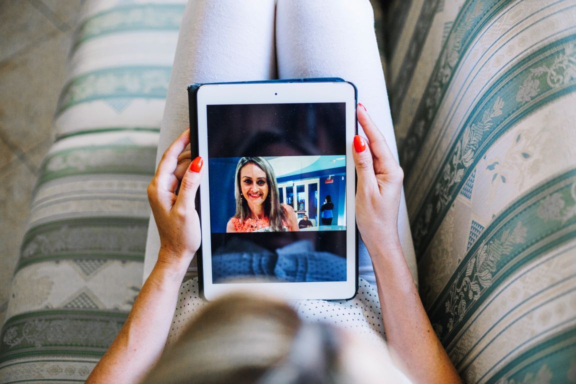 woman-watching-photos-tablet